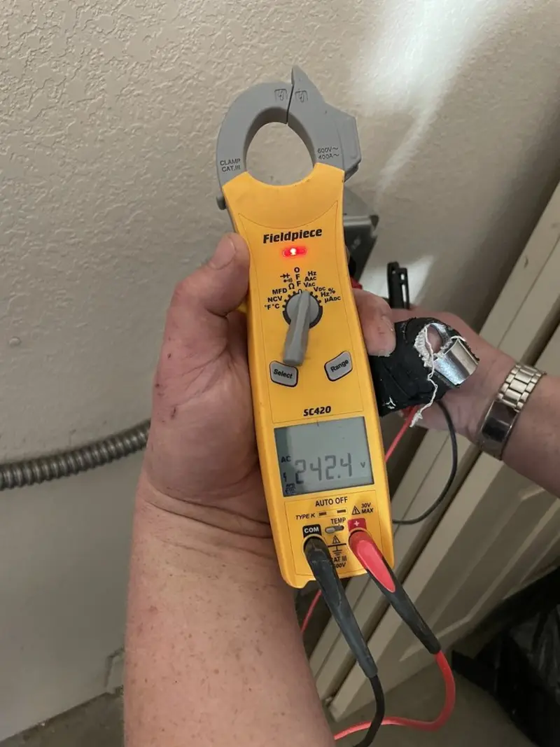 Voltage testing with clamp meter during Electrical Installation Services in Hartland